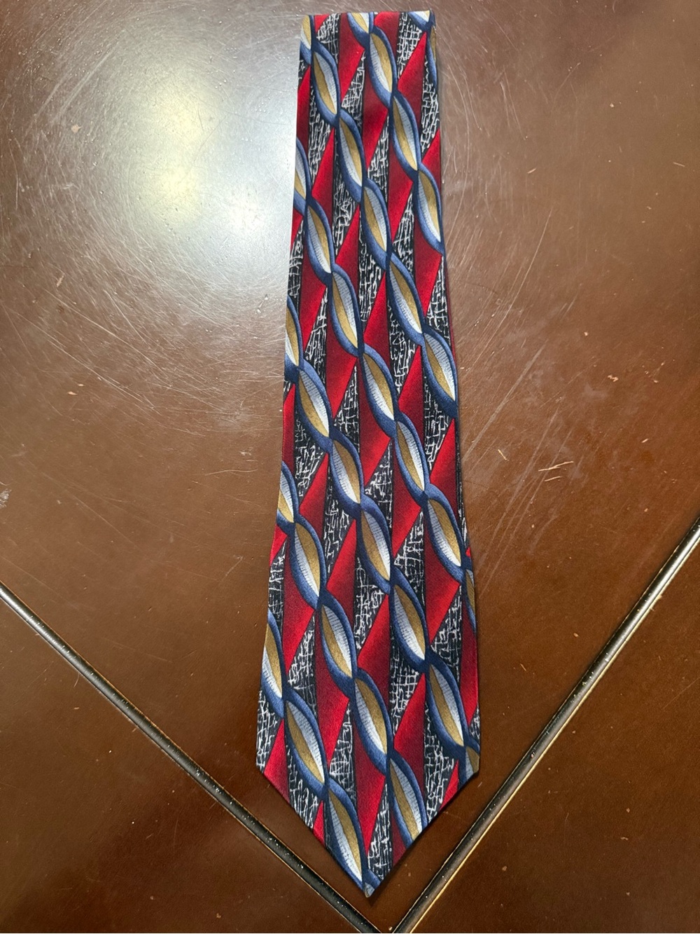 Men's Red Geometric Pattern Tie with Blue and Gold Accents